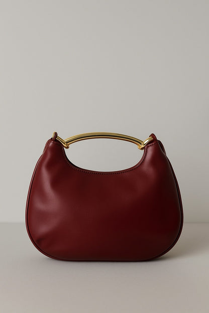 Bolso trenzado con asa metálica