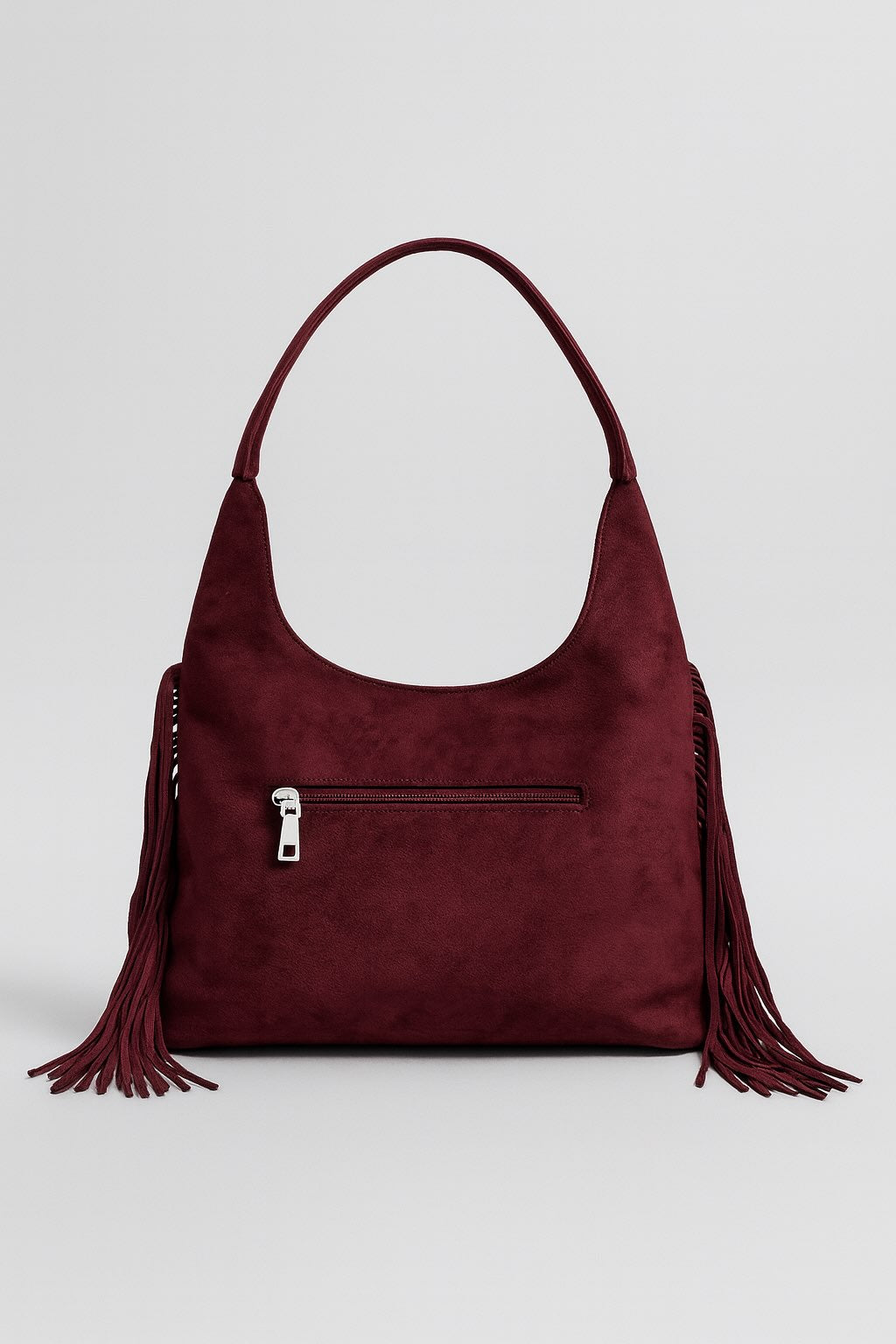 Bolso antelina de tachuelas con flecos