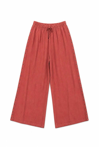 Pantalón fluido tachuelas