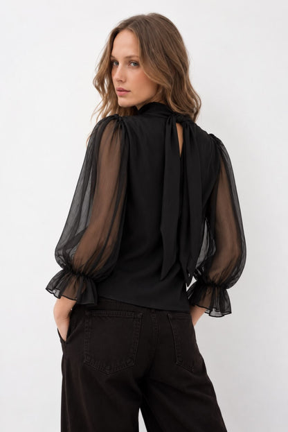 Blusa cruzada semitransparente