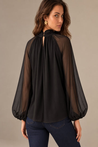 Blusa fluida con cuello alto